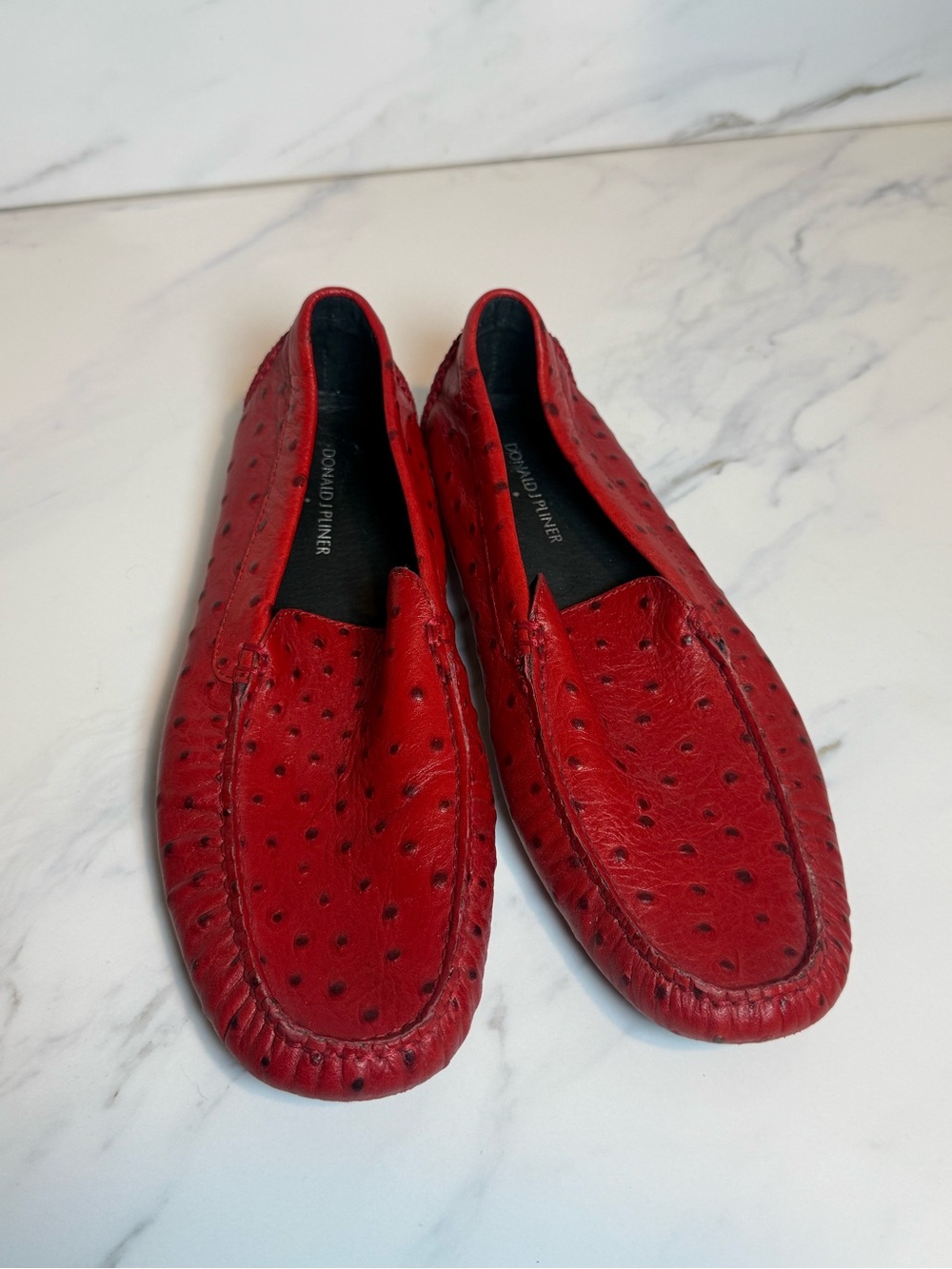Red animal skin croc loafers